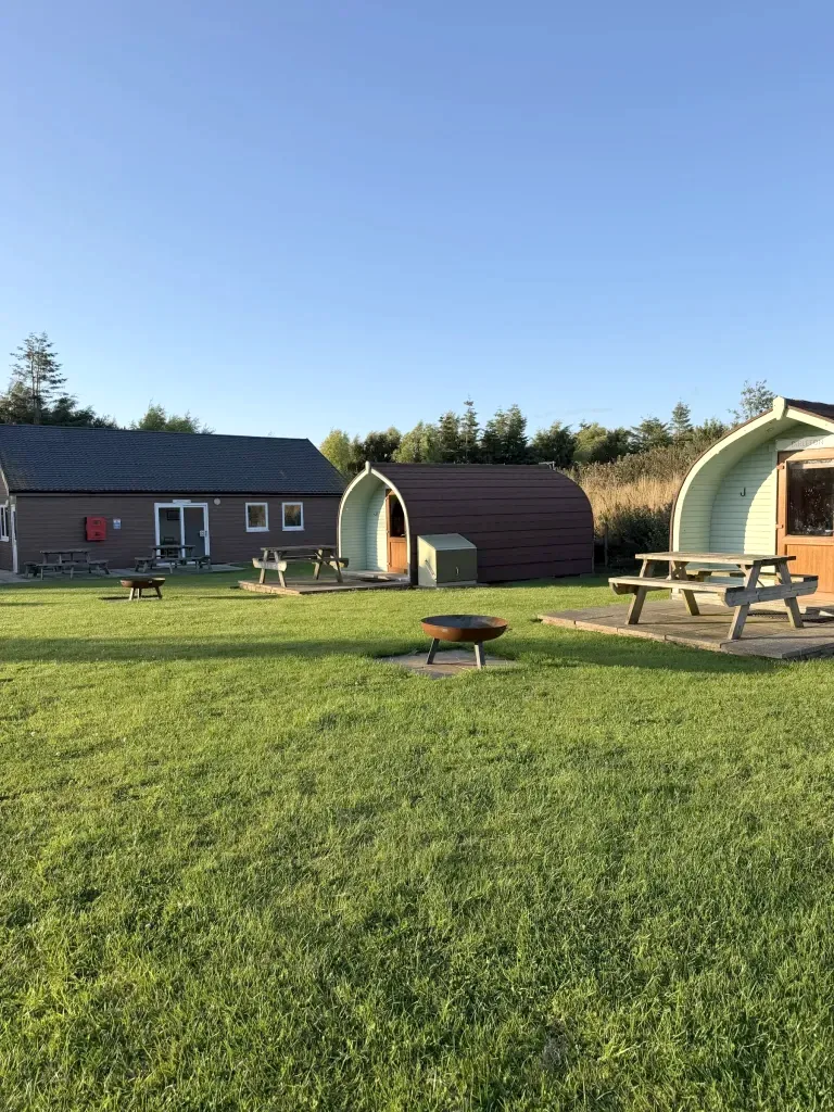 Glamping pods beside the facilities block at Gilsland Park