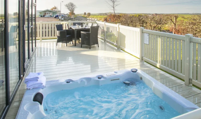 A private hot tub on the decking of a hot tub lodge at Gilsland Park, North Berwick