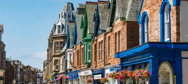 Colourful shopfronts and hanging baskets on North Berwick High Street